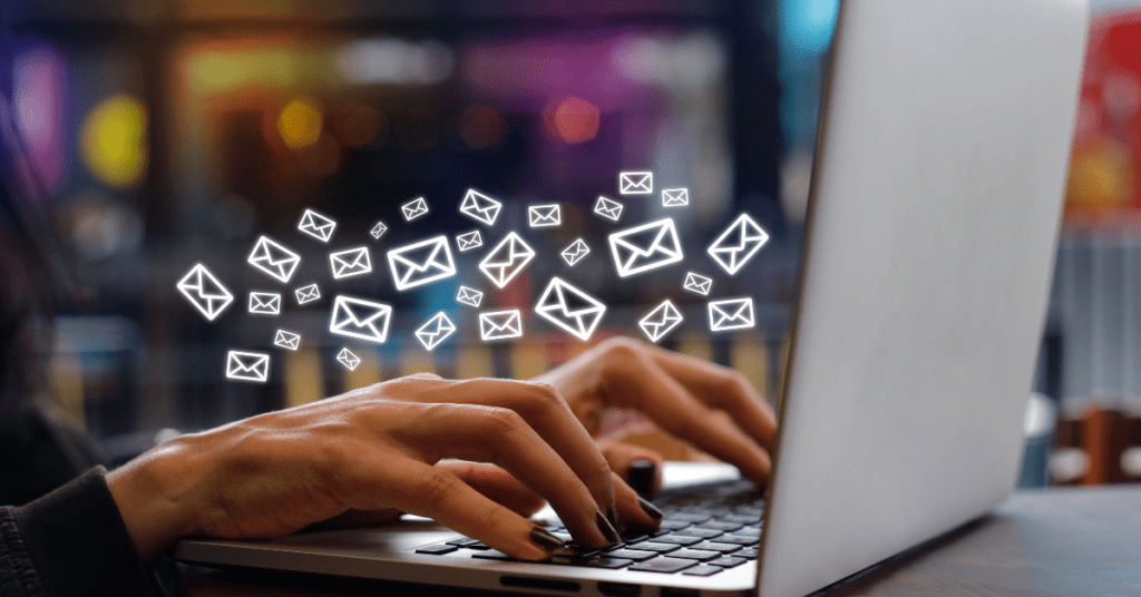 hands on laptop with tiny email envelopes springing up - 4 Email Marketing Growth Hacks
