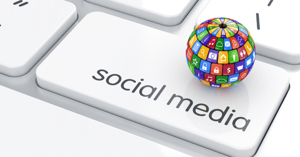 white keyboard with a key that says social media and a colorful globe with all the social media platforms icons on it . Picture for the blog How Do SEO and Social Media Work Together? For Web Garden Marketing